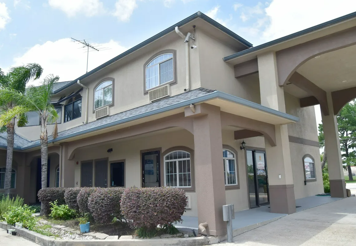 Camelot Inn & Suites Highway 290 NW Freeway hotel hero